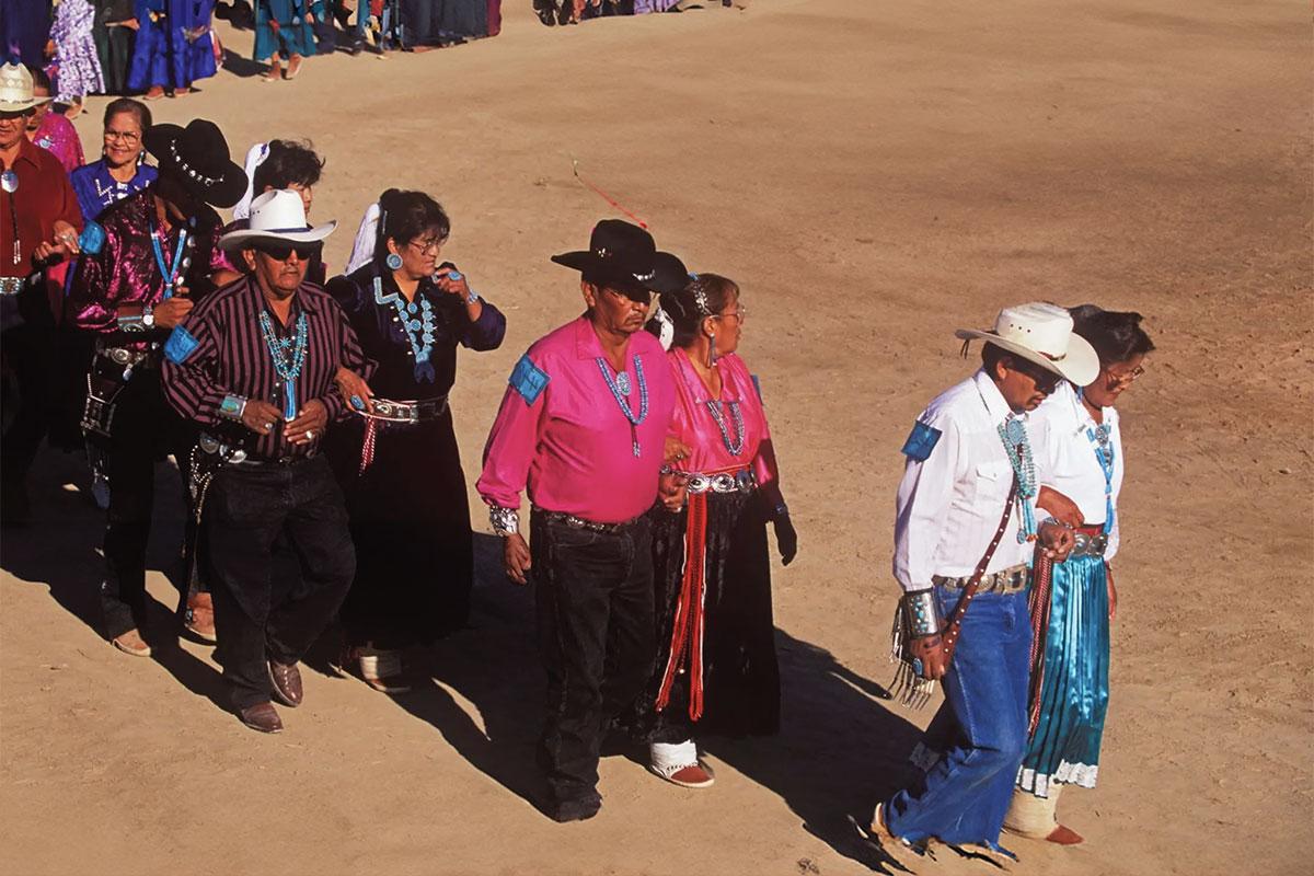 Group of individuals performing at the Navajo Song and Dance